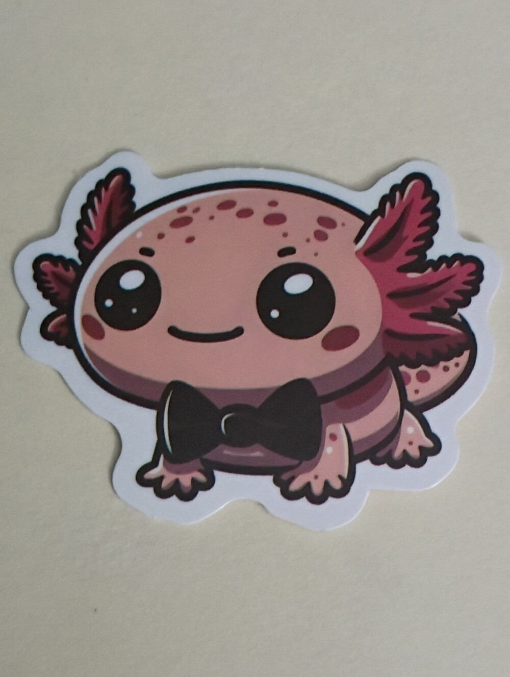 10/$10 Sticker - Pink Axolotl Peach-Cream Color w/ Freckles Wearing Black Bowtie